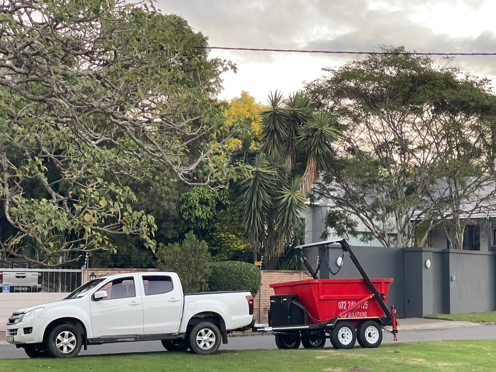 Skip Solutions delivering a red 3 cubic metre skip